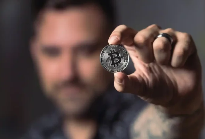 man-holding-bitcoin