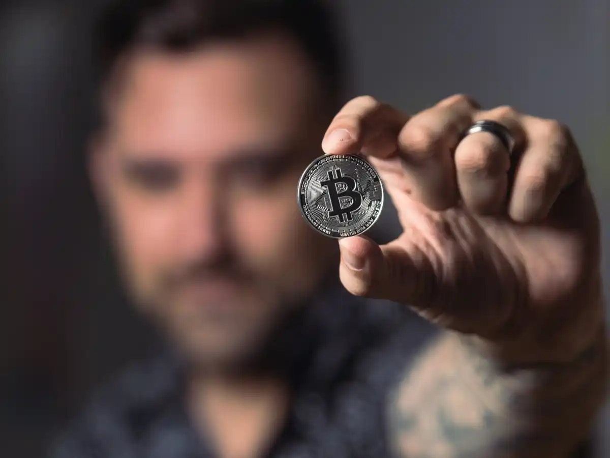 man-holding-bitcoin