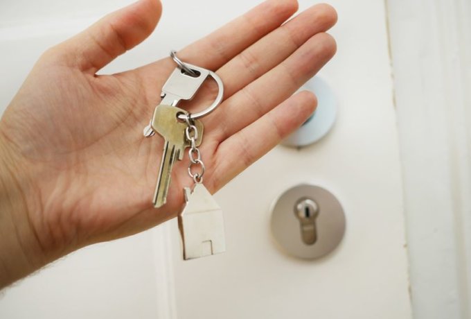 person-holding-house-keys