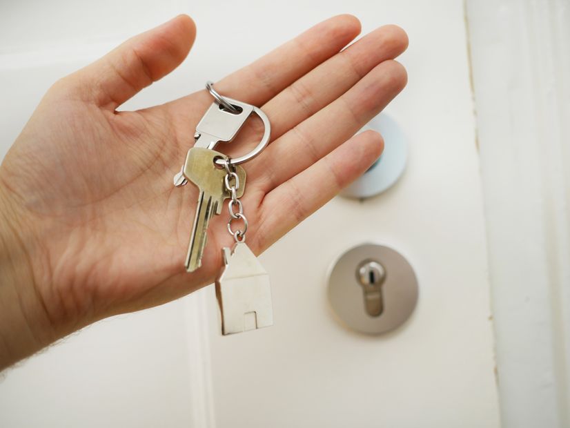 person-holding-house-keys