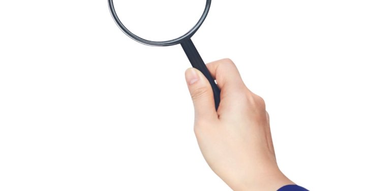 hand-holding-magnifying-glass